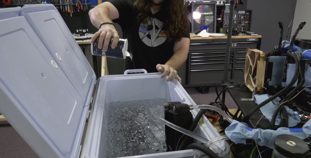 Steve Burke of Gamers Nexus uses salt to lower the temperature of his ice-bucket cooler.