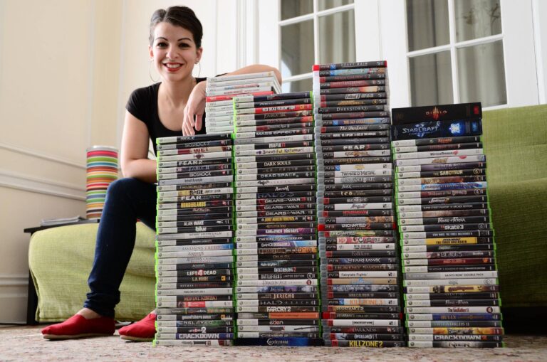 Anita Sarkeesian of Feminist Frequency with the games she purchased as part of her research back in 2014.
