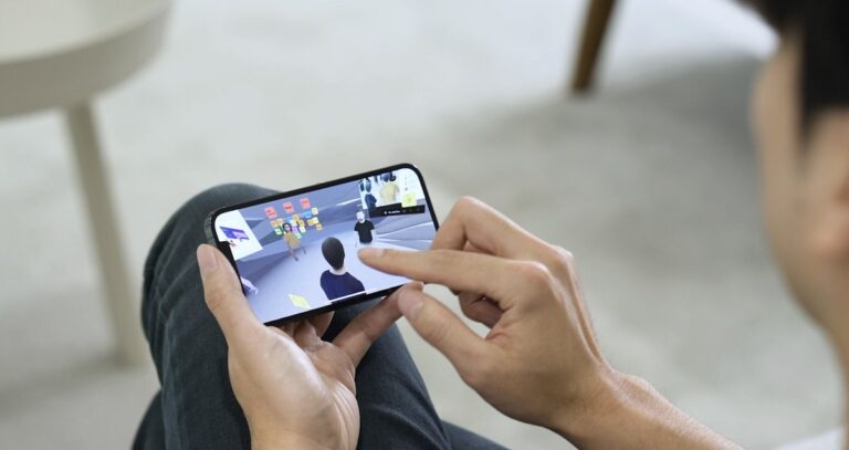 Spatial has a mobile AR version that you can access with a smartphone.
