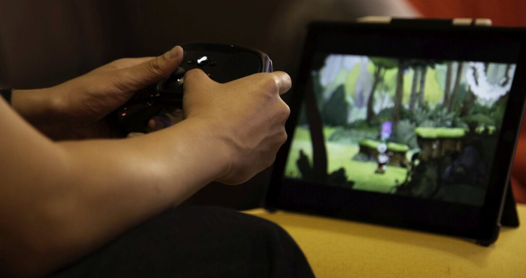 Steam Link app on a tablet with a Steam Controller.