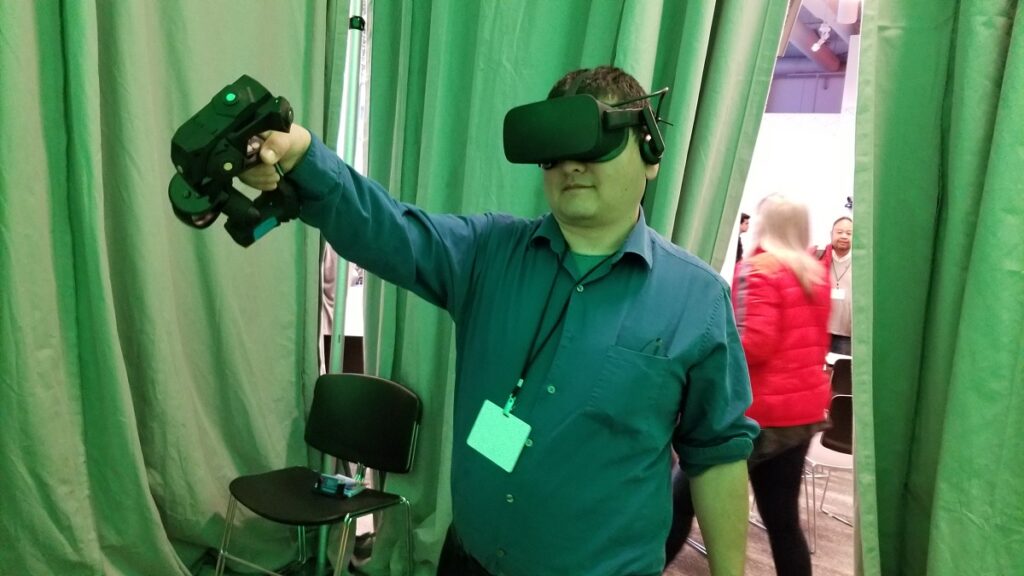 Dean Takahashi demos the Tactical Haptics Reactive Grip controller.