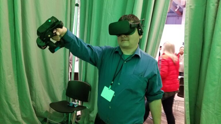 Dean Takahashi demos the Tactical Haptics Reactive Grip controller.