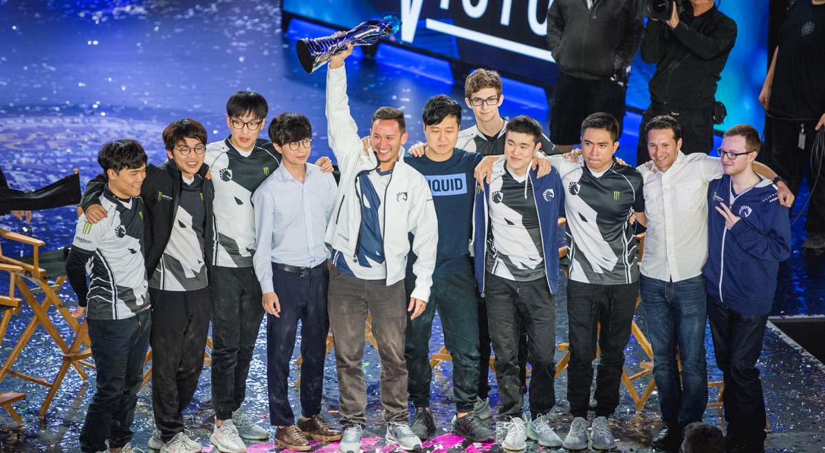 Steve Arhancet holds trophy as Team Liquid wins the spring finals for the North American LCS esports tournament.