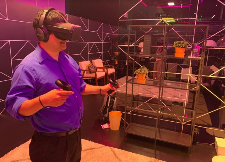 Dean Takahashi of GamesBeat gets ready to swing a lightsaber in Vader Immortal.
