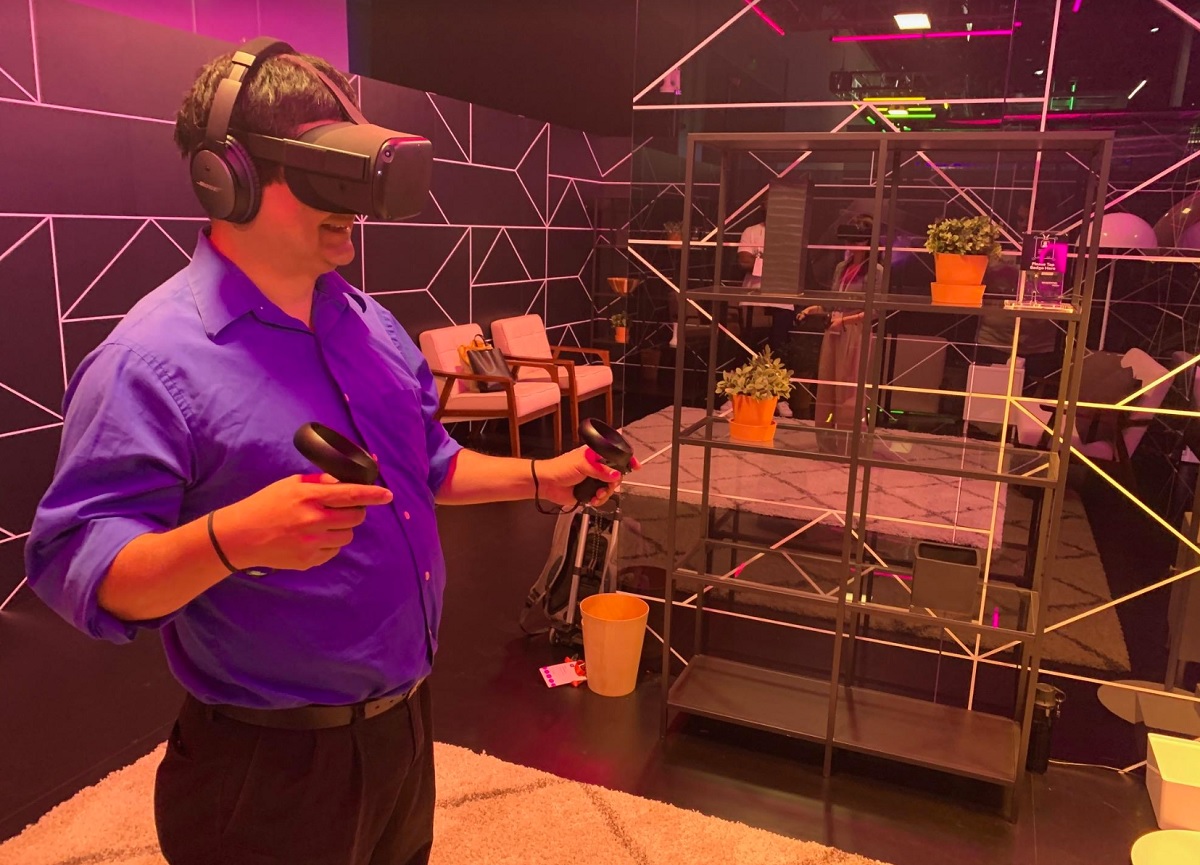 Dean Takahashi of GamesBeat gets ready to swing a lightsaber in Vader Immortal.