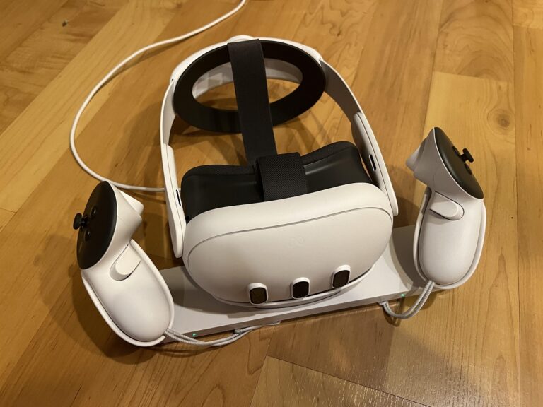 The Meta Quest 3 with Elite Strap on its charging dock.