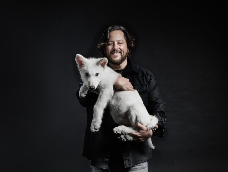 Ben Lamm holds one of the dire wolf pups.