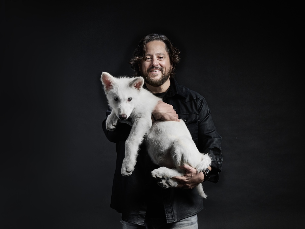 Ben Lamm holds one of the dire wolf pups.
