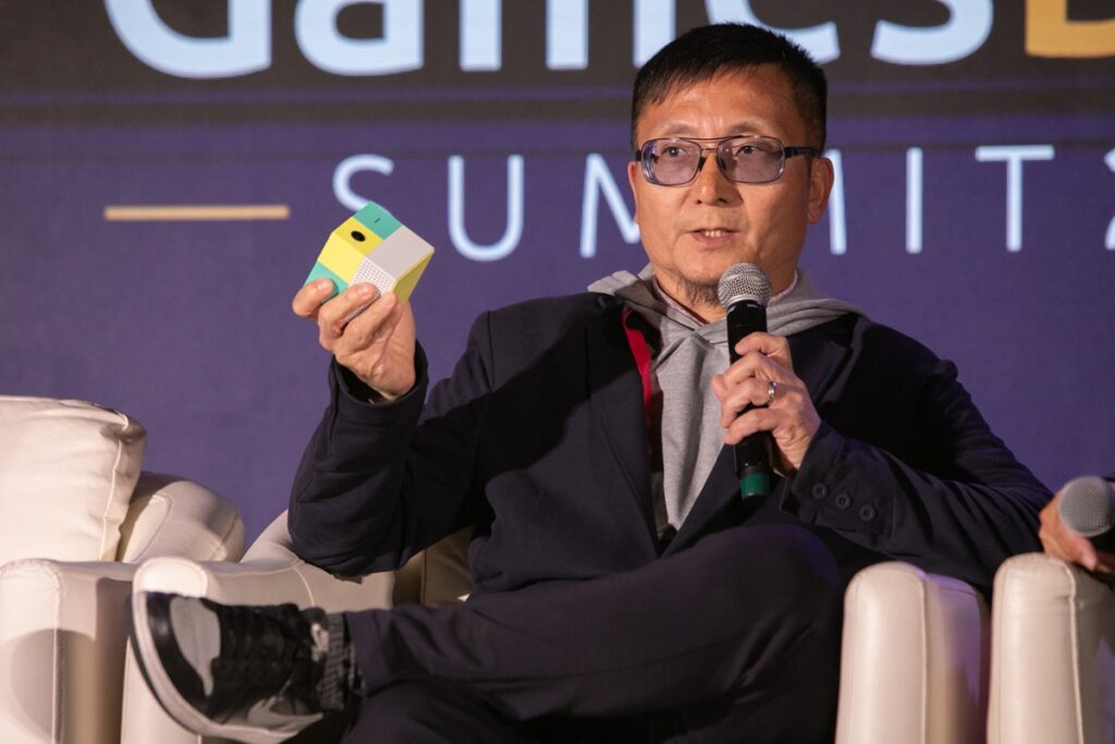 Tom Kang, president of Nex, holds the Nex Playground at GamesBeat Summit 2025.
